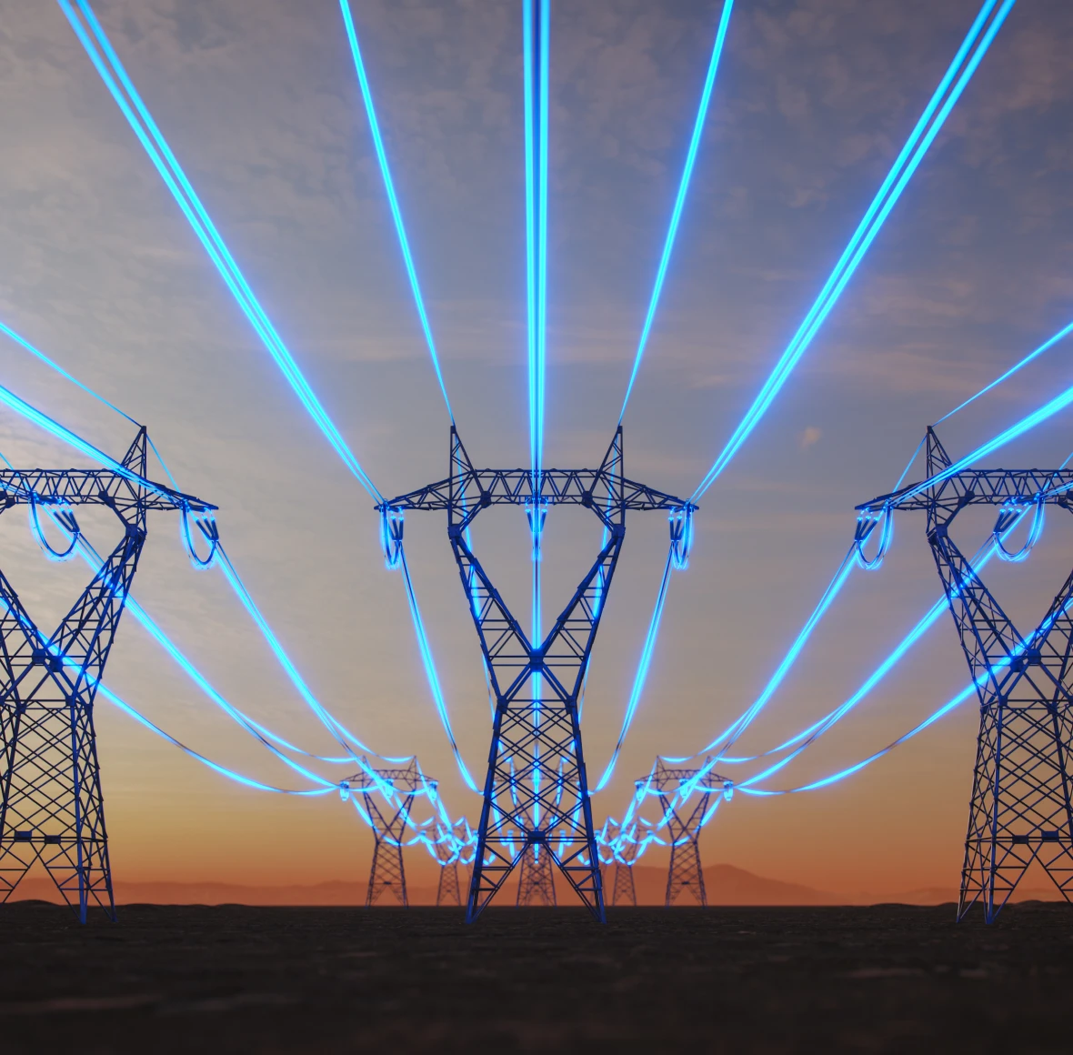 Transmission towers during vibrant evening sky