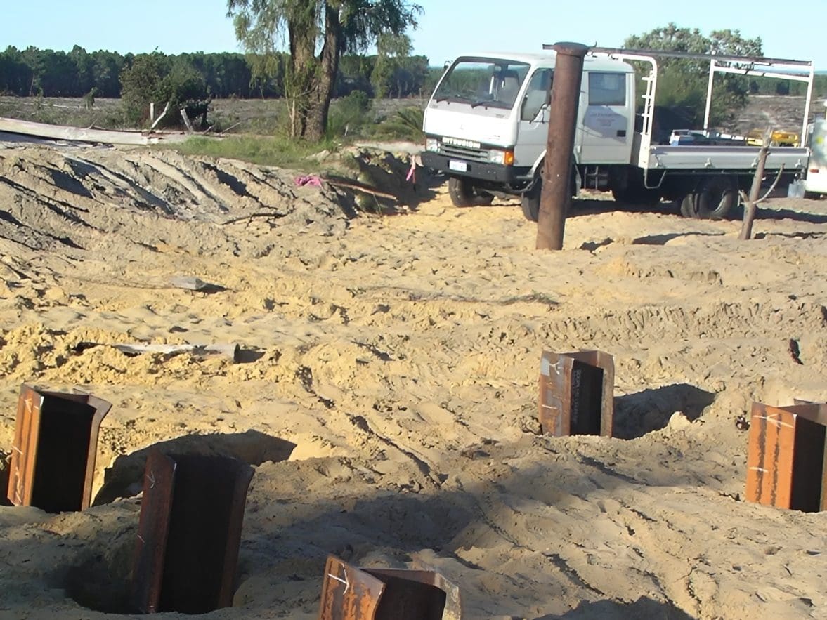 Truck parked at sandy construction area