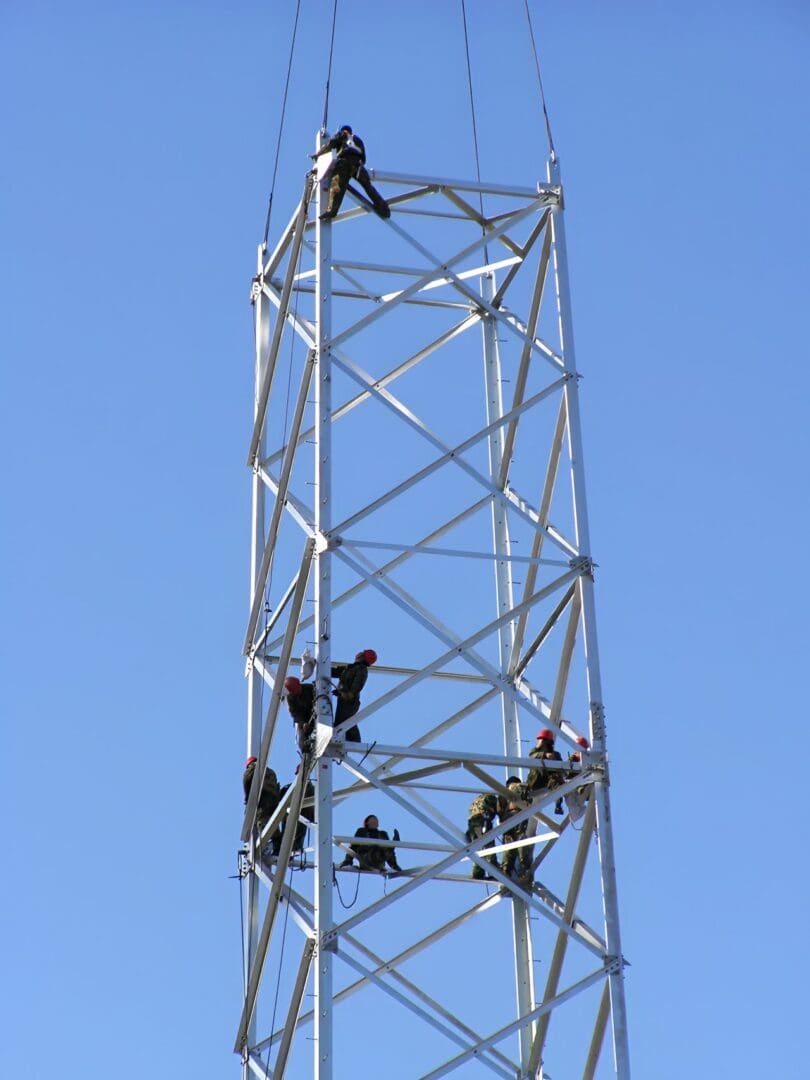 Construction workers on communication tower